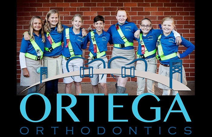 Group of kids with braces smiling