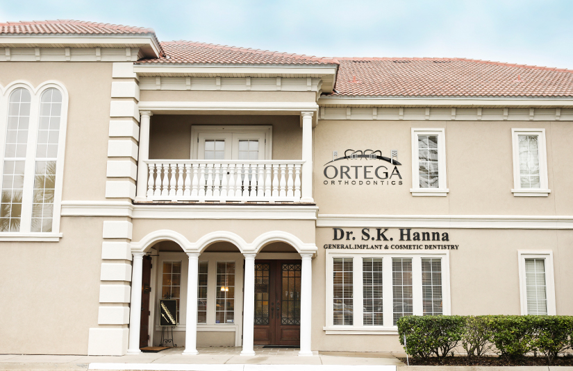 Closeup of outdoor Ortega Orthodontics sign
