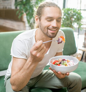 Patient in Jacksonville eating after removing their Invisalign aligner